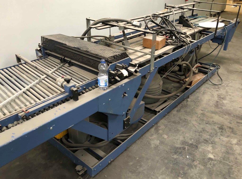 Used H&H 291 vacuum belt with inclined roller table and cutting unit