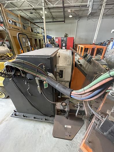 Used FANUC ARCMATE 120iC/10L MIG WELDING CELL WITH 2 AXIS 10' LONG DROP CENTER TRUNNION W/ROTARY CNC TABLE