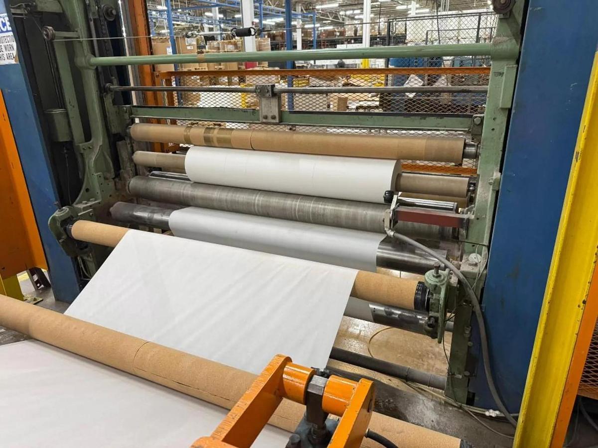 Used 84" WIDE SHANKS TWO DRUM SLITTER REWINDER WITH SHAFTLESS FLOOR PICK UP UNWIND STAND