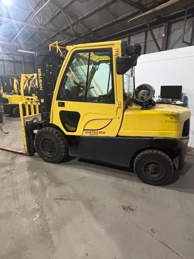 Used 10,000LB CAPACITY HYSTER H100FT FULL CAB 4-WAY HYDRAULICS WITH FORK POSITIONER