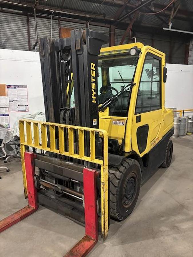 Used 10,000LB CAPACITY HYSTER H100FT FULL CAB 4-WAY HYDRAULICS WITH FORK POSITIONER