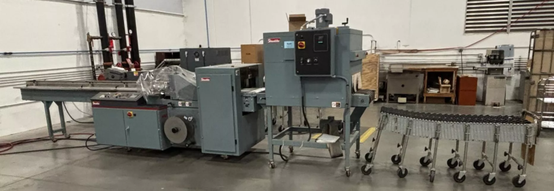 Used SHANKLIN  MDL. F-5A AUTOMATIC SIDE SEAL SHRINK WRAPPER SYSTEM