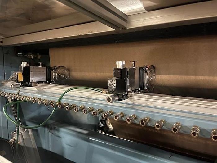 Used 54" JENNERJAHN COUNTER ROLL REWINDER WITH SLITTING REBUILT 2006