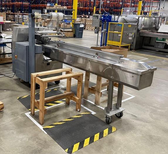 Used AMERIPAK # 40 HORIZONTAL WRAPPER w/ 6’ SS LUGGED INFEED CONVEYOR