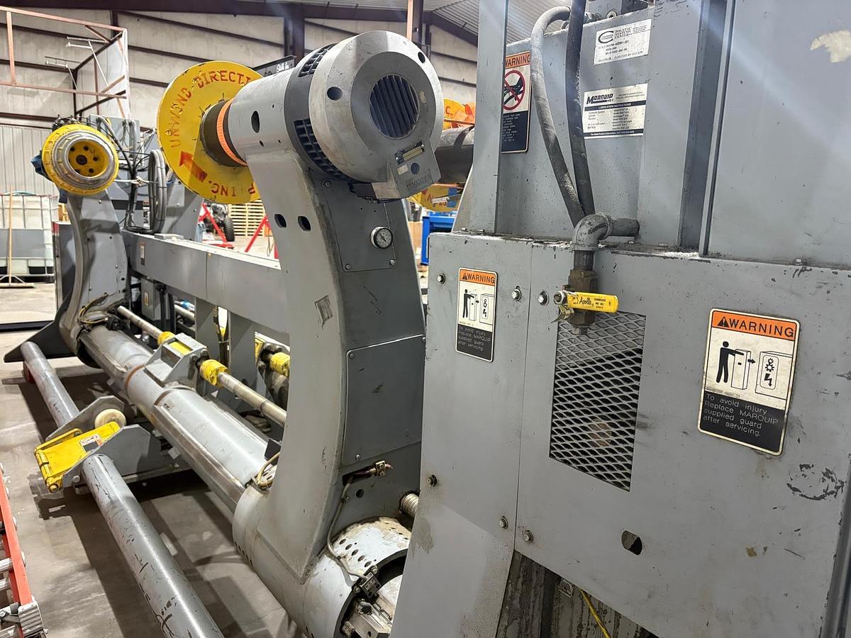 Used MARQUIP 72" X 72" DUAL SHAFTLESS FLOOR PICKUP UNWIND STAND 1999