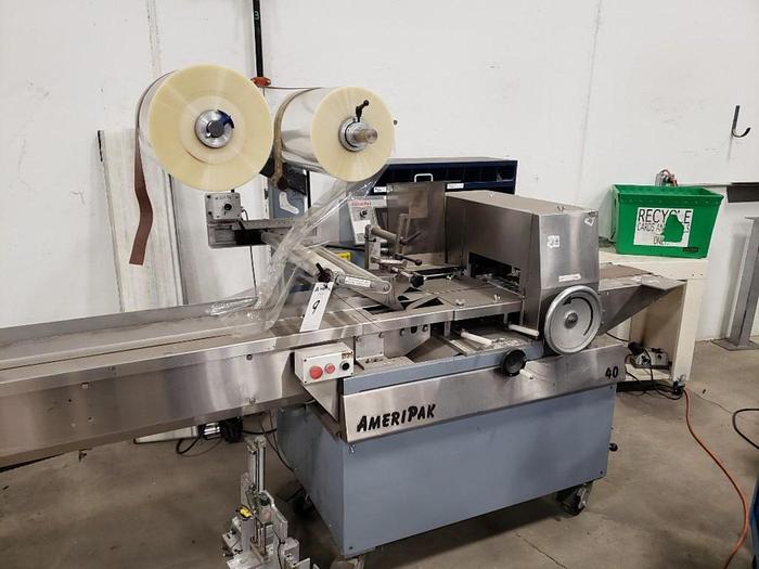 Used AMERIPAK # 40 HORIZONTAL WRAPPER w/ 10’ SS LUGGED INFEED CONVEYOR