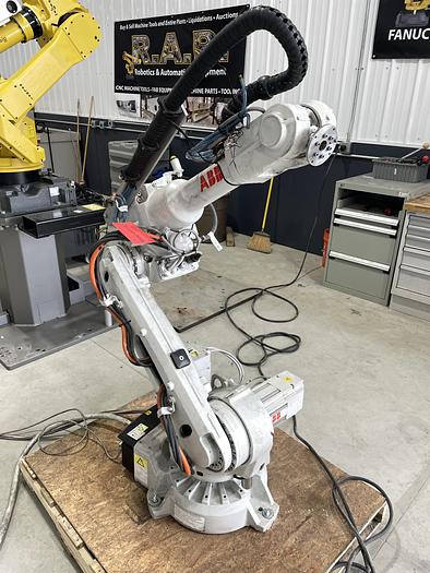 Used ABB IRB 2600-12/1.65 ROBOT WORK CELL CONSISTING OF 2 IRB 2600 ROBOTS RUNNING OFF OF 1 IRC5 CONTROLLER
