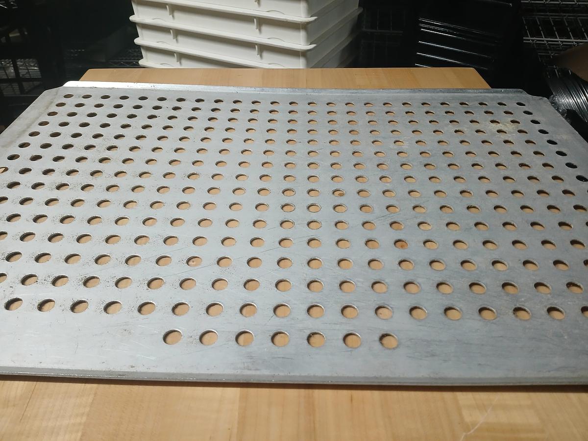 Used Perforated stainless‑steel baking/cooling sheet