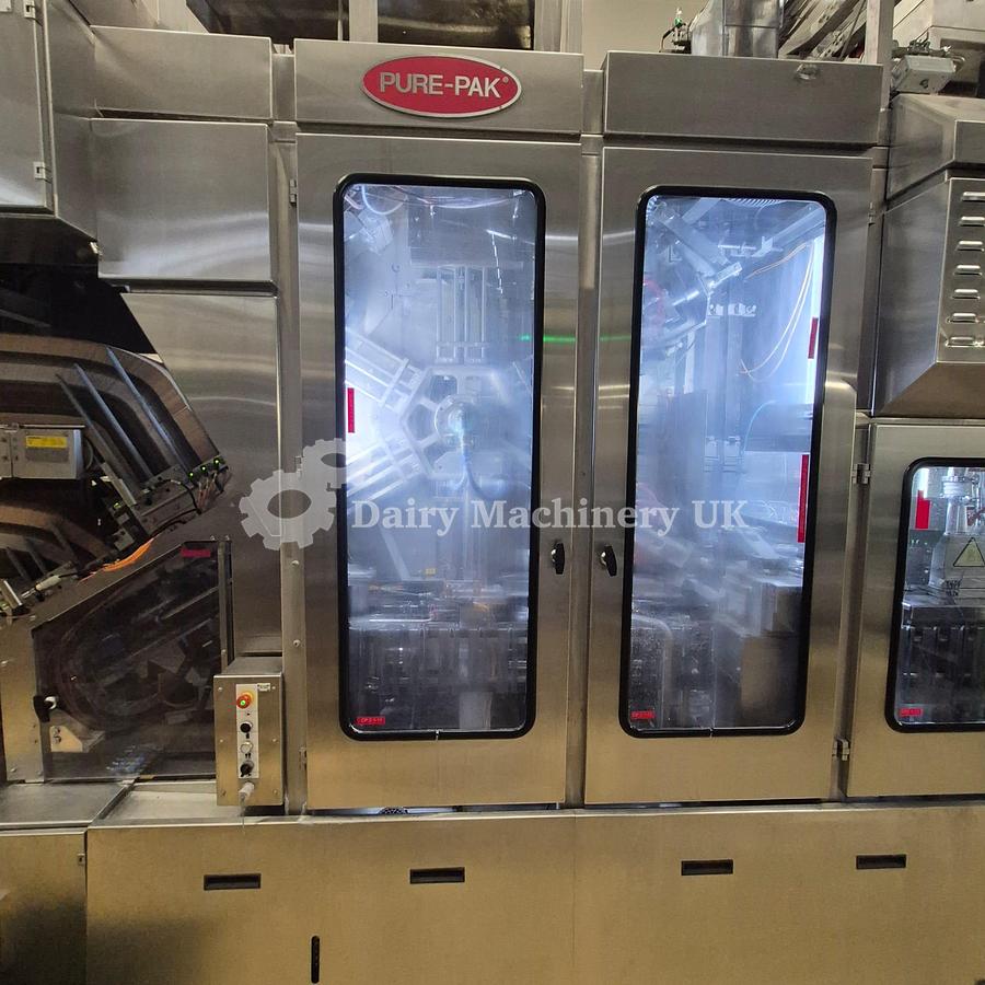 Used ELOPAK PURE PAK GABLE TOP FILLER WITH WRAP AROUND CARDBOARD PACKER