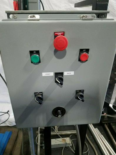 Used Rapid Motorized Double Sided Stock Reel Material Feed with control panel