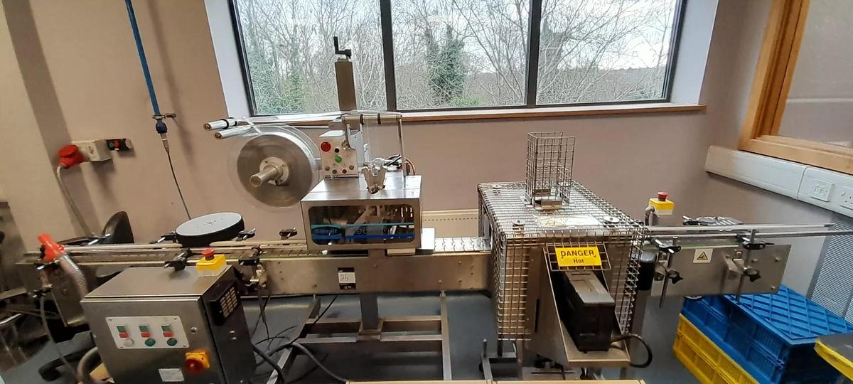 Used Turpins Packaging Systems Sleevit Lite 60 sleever, Serial Number SM742 & conveyor & shrinkwrap tunnel. Sleevit Lite 60