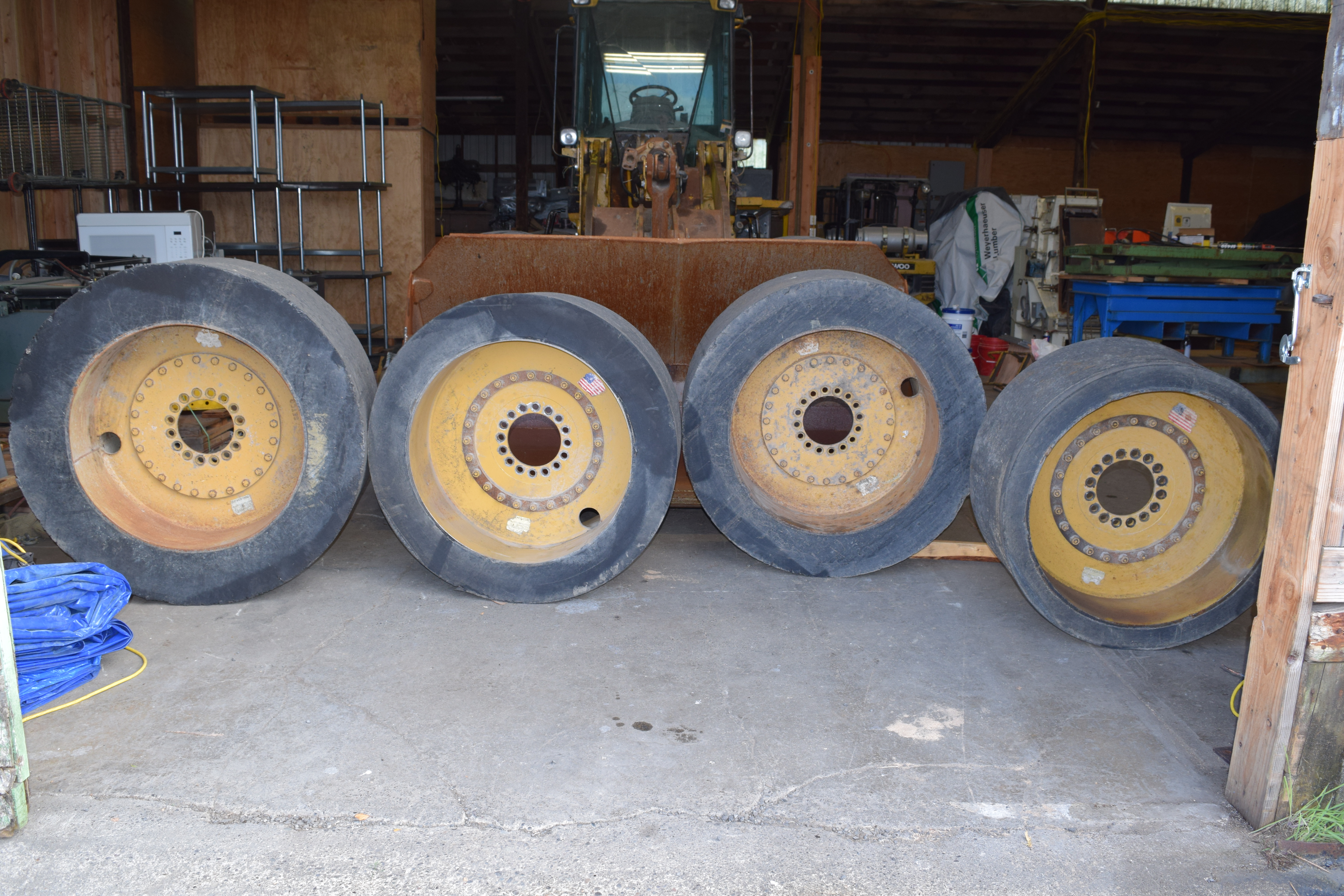 Used Setco interchangeable center hubs tires, Setco solid cushion wheels tires, Caterpillar 938 G solid tires used, wheel loader cushion tires wheels, used Caterpillar 938g wheel loader solid tires, Setco R74754,