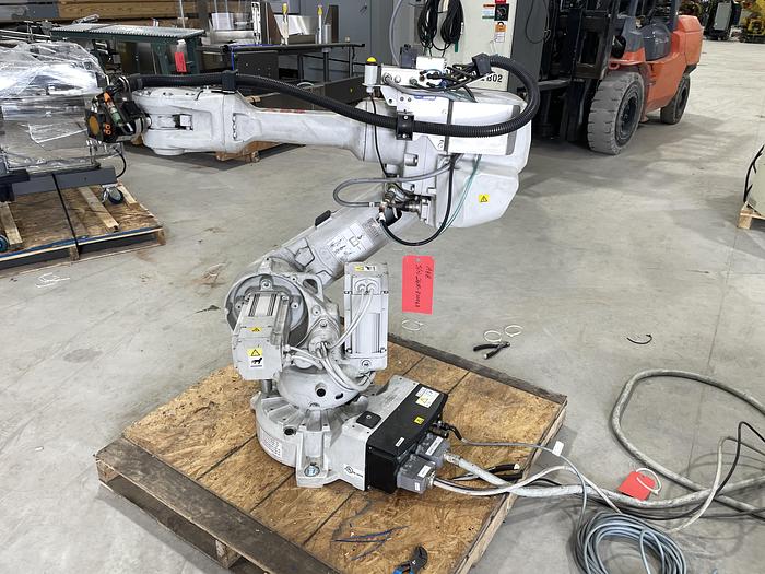 Used ABB IRB 2600-12/1.65 ROBOT WORK CELL CONSISTING OF 2 IRB 2600 ROBOTS RUNNING OFF OF 1 IRC5 CONTROLLER