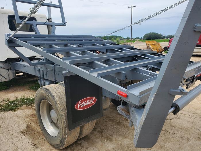 Used 1990 Peterbilt w/ New Holland 1051 Stack Retriever