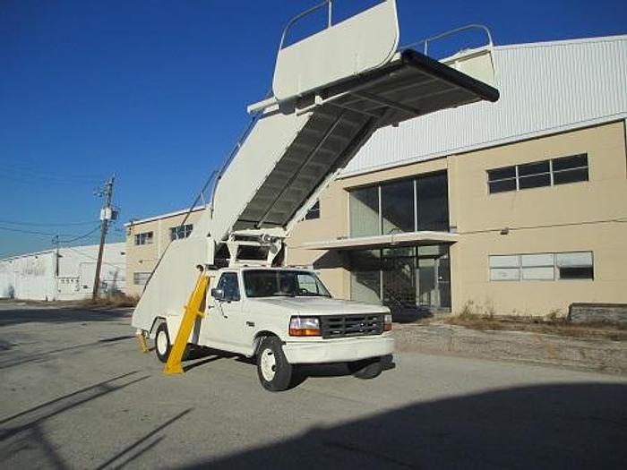 Used Hobart/Wollard Stair Truck. Services wide body aircraft. Max Height 17' Model: TLPH252SM.