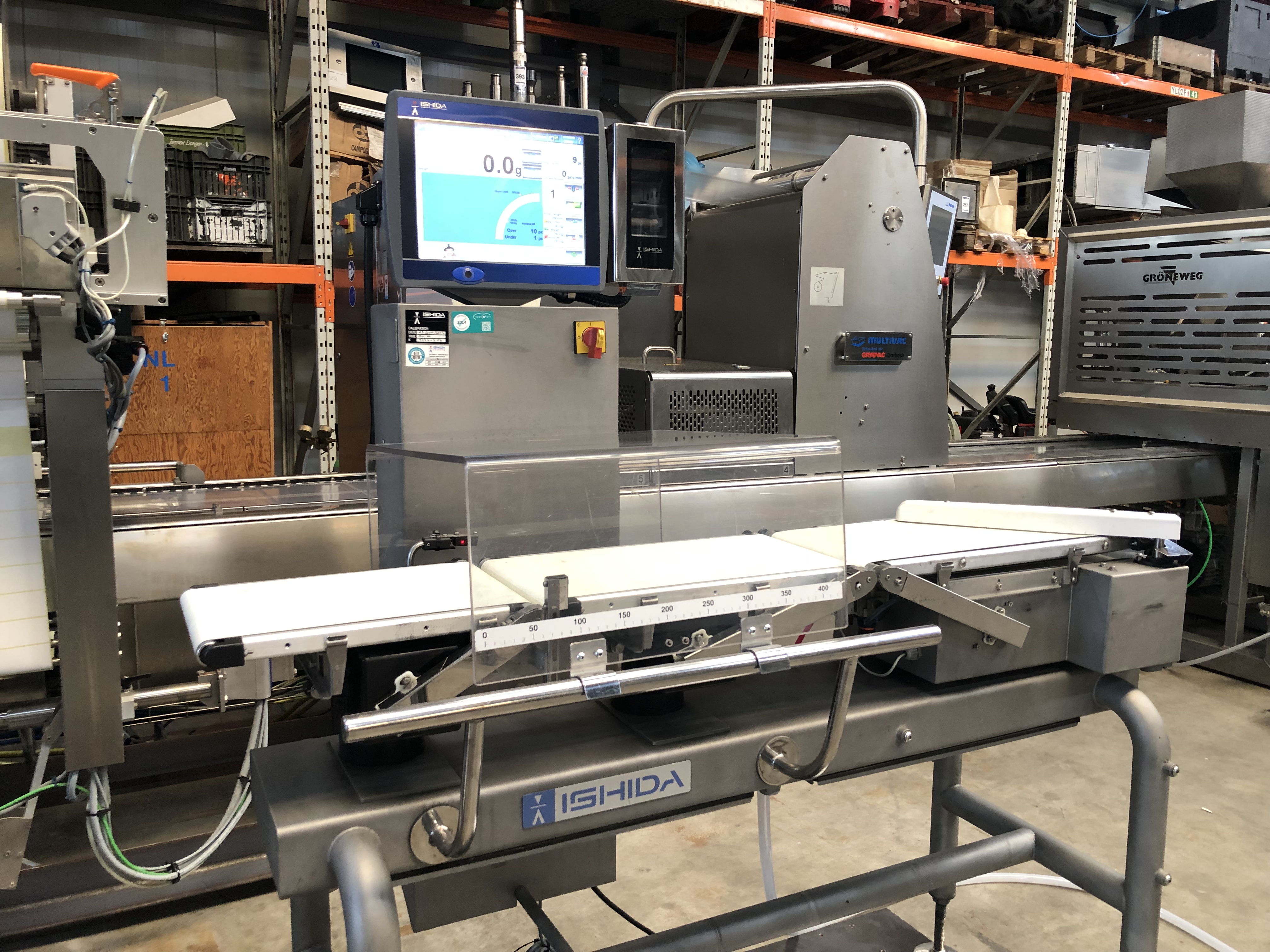 Used Ishida checkweigher with automatic reject system.