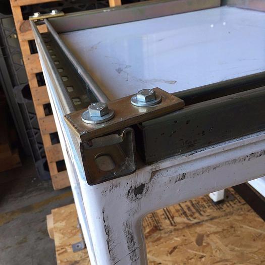 Used Heavy duty steel frame work tables with adjustable feet.