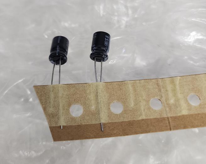 Used NICHICON (VA) 493-11528-1-ND CA ALUM 100UF & NICHICON 483-571-ND CAP ALUM 4.7UF