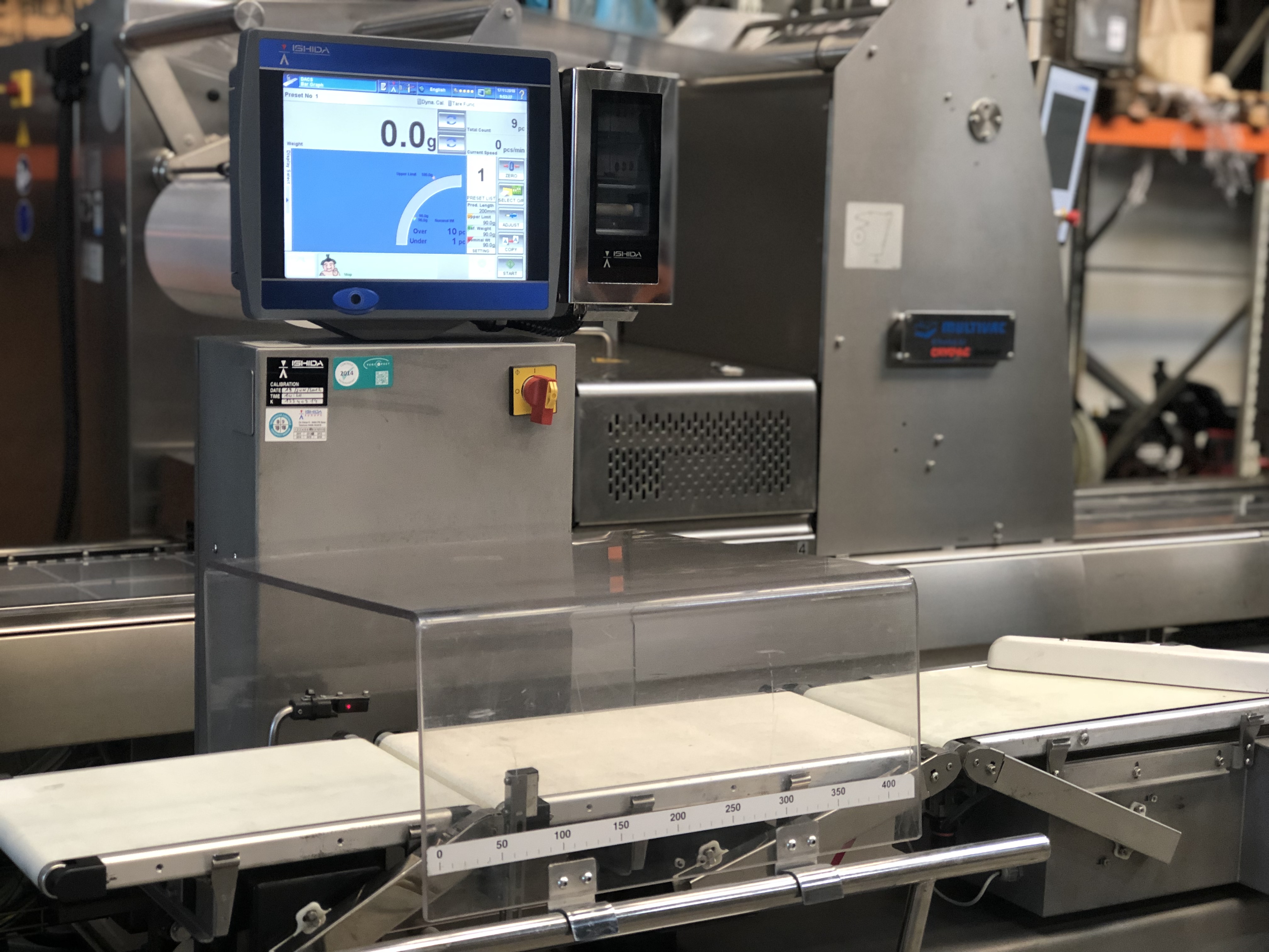 Used Ishida checkweigher with automatic reject system.
