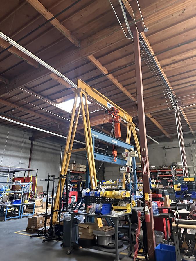 Used SPANCO GANTRY, MODEL #7PF1818 MANUAL PF SERIES GANTRY CRANE STEEL FIXED HEIGHT AND SPAN Capacity: 15000 lbs Overall Span: 18' - 0'' Clear Span: 15' - 0'' Height Under Beam: 18' - 0'' Overall Height: 19' - 6'' **(Hold)** Tread Width: ± 6' - 8'' Beam Size: S18X54.7#with cap channel Casters: 12'' Polyurethane Tread W/4 Position Swivel Locks Flange Width: 6" End of Gantry Load: 18812 lbs Load per Wheel: 9406 lbs Estimated Weight (Each): 3125 lbs Load per Wheel: 9406 lbs Coating & Painting: PAINT, SPRAY YELLOW   ELEPHANT DAM-7.5-20-3-460-60 Elephant DAM Series Electric Chain Hoist w/ Motorized Trolley Capacity: 7.5 ton metric tons (16,500 lbs.) Chain Length: 20' Pendant Length: 18' No. of Falls: 3 Lifting Speed: 7 FPM 3 Phase - 460v Only - 60Hz Lug mounted to MAS Trolley Flange Range: 5.00" ~ 7.00"" Traversing Speed: 39 FPM Includes E-Stop Pendant and Chain Container Elephant JAPAN -ASME H3 MOTOR - CORROSIVE RESISTANT LOAD CHAIN - JIS / ISO M5 - FEM 2m - IP54 HOIST PROTECTION - IP65 NEMA 4X PENDANT PROT.