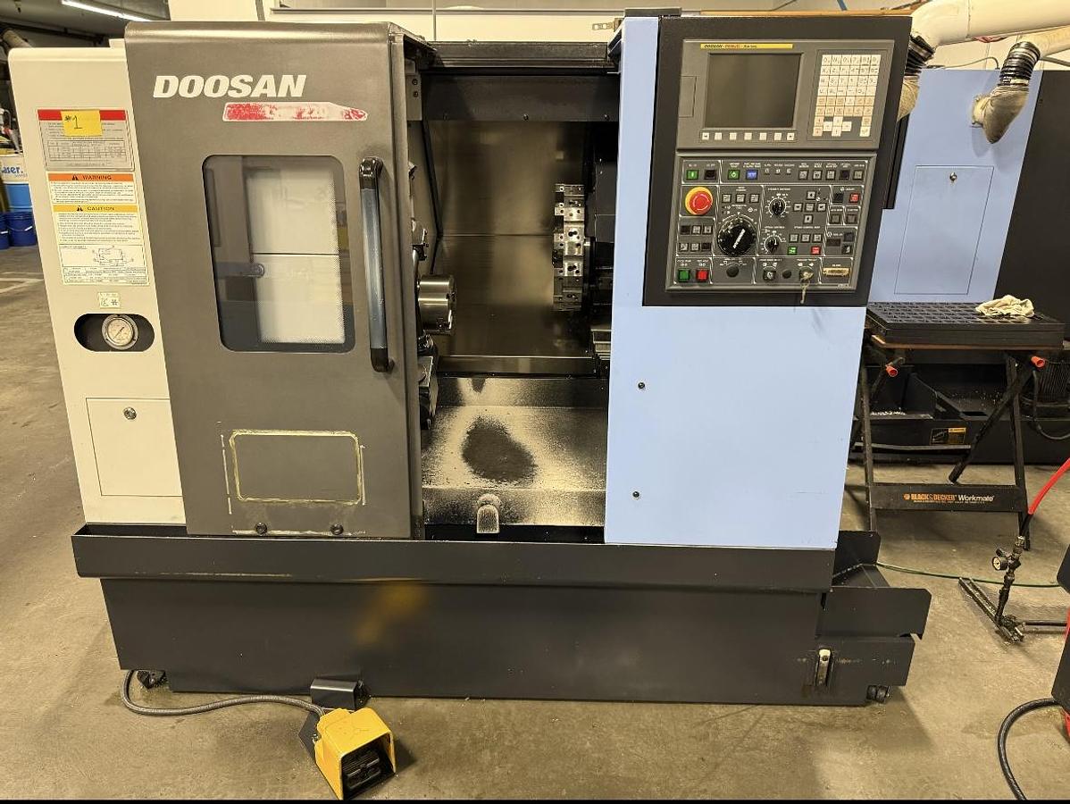 Used 2011 Doosan Lynx 220A-NT, Fanuc iSeries CNC Control, tail stock, 6” 3-Jaw Chuck, foot control, 12 station turret, no tail stock, s/n ML0006-005208