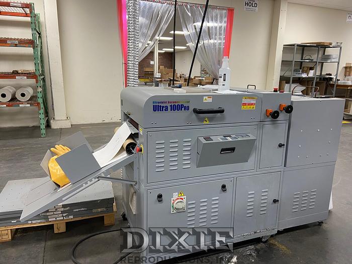 Used 2015 Duplo Ultra 100A UV Coater, Feeder