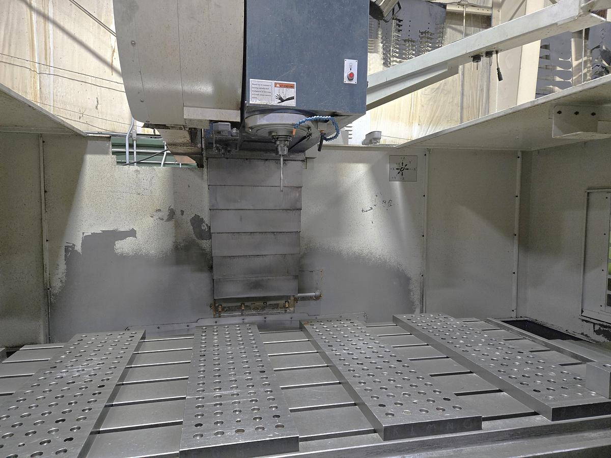 Used 2004 Takumi V-22 with Coolant Thru Spindle, Conveyor, 24 Pos. Side Mount ATC, RJH, Boxed Ways, Fanuc Control