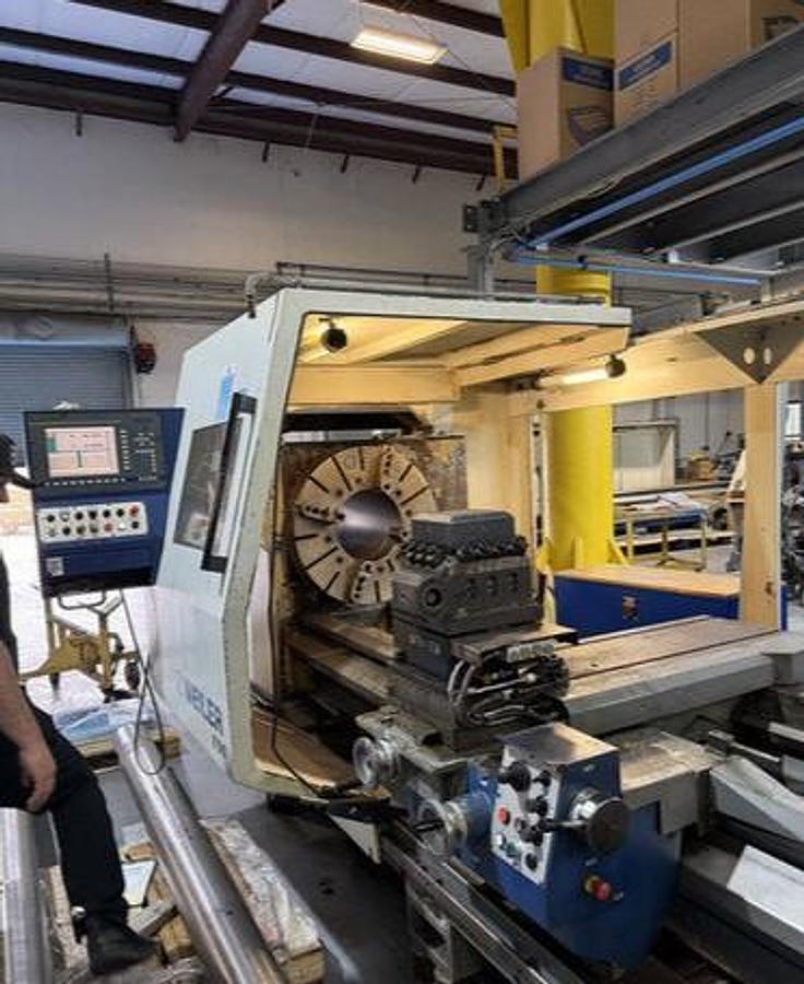 Used 2008 Weiler E90/2000 with 14" Bar Capacity, (2) 31" 4 Jaw Chucks, 80" cc, Chip Conveyor, Tailstock, Steady Rest, Weiler Control