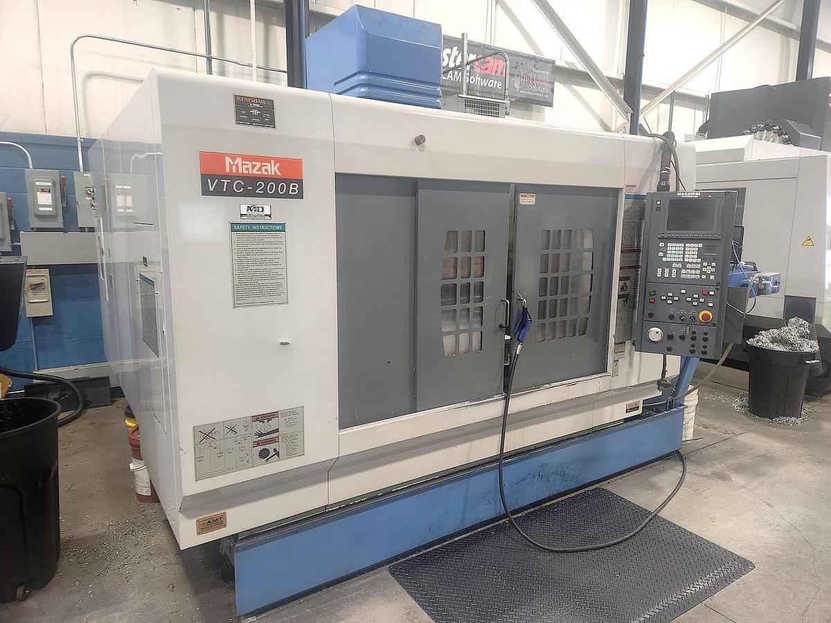 Used 2000 Mazak VTC200B with Chip Conveyor, 30 Station Side Mounted Tool Changer, Very Nice Condition, Located in Ontario, Canada