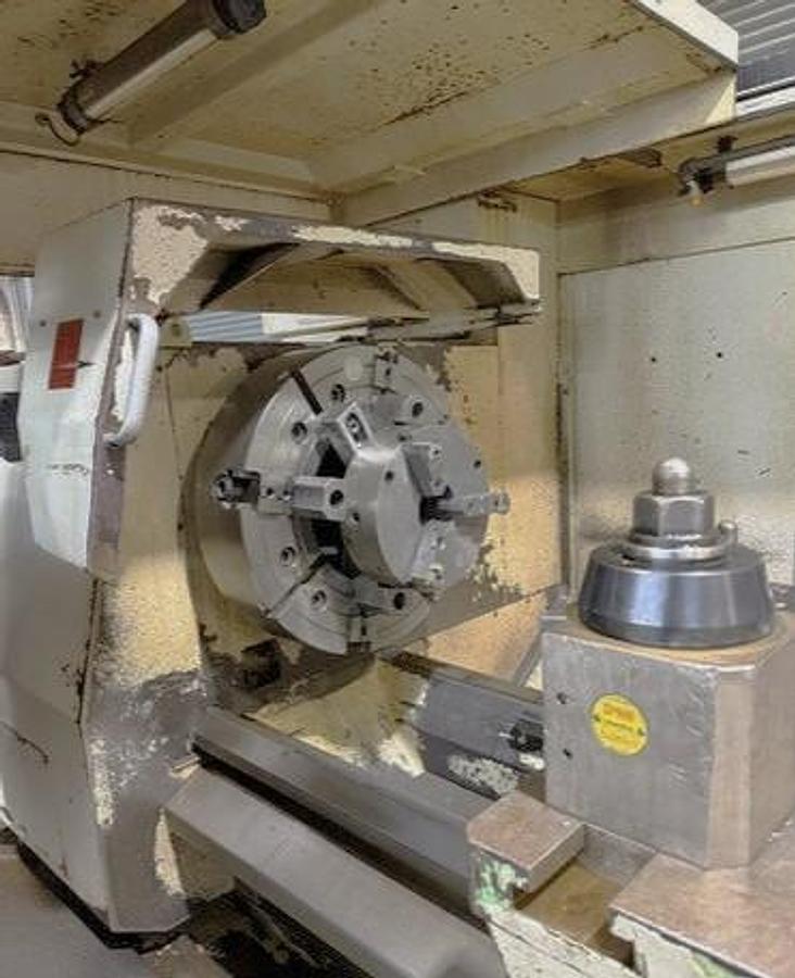 Used 2008 Weiler E90/3000 with 14" Bar Capacity, (2) 31" 4 Jaw Chucks, 120" cc, Chip Conveyor, Tailstock, Steady Rest, Weiler Control