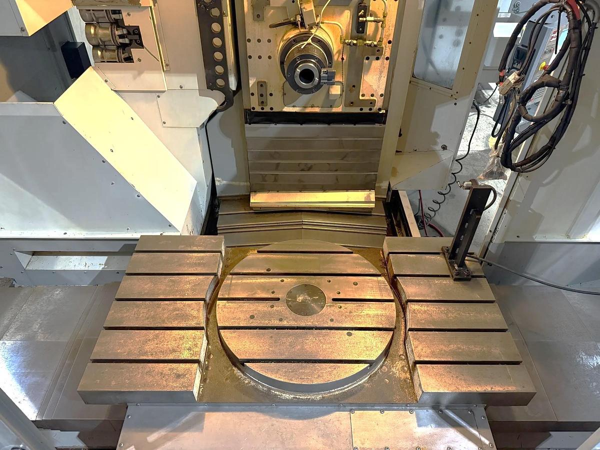 Used 26 Haas EC-1600-4X with 5 Axis Capability, Built In 4th Table, Removable 5th Axis Rotary Table, 50 ATC, Probing, Cool. Thru Spindle