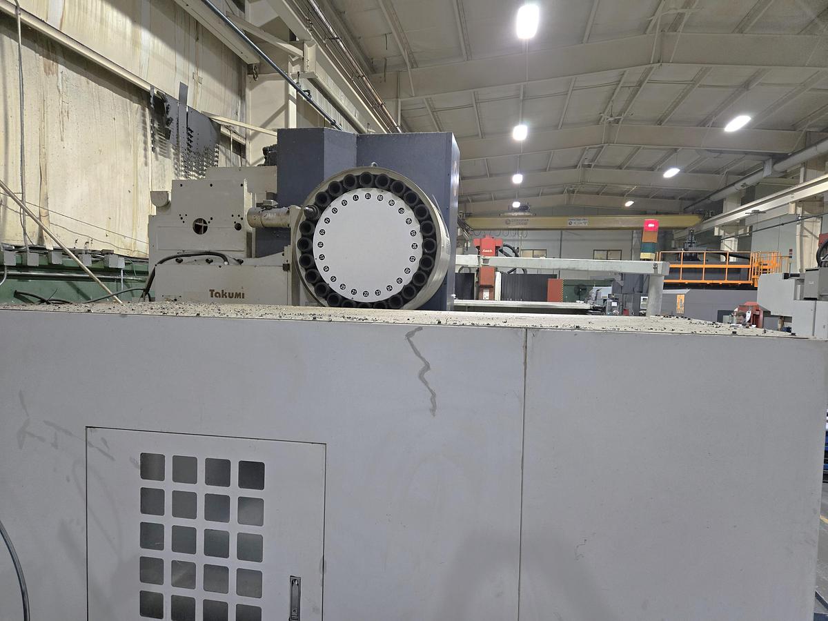 Used 2004 Takumi V-22 with Coolant Thru Spindle, Conveyor, 24 Pos. Side Mount ATC, RJH, Boxed Ways, Fanuc Control