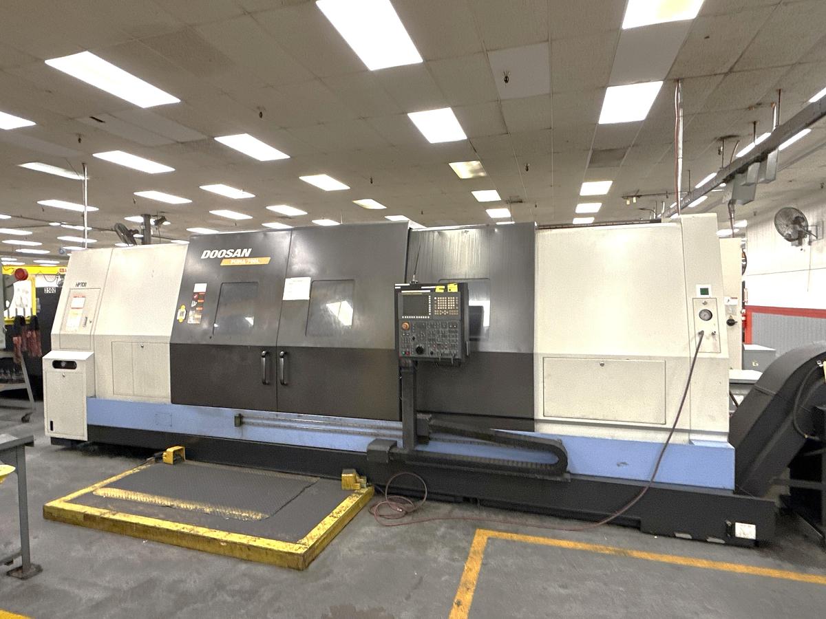 Used 2012 Doosan Puma 700L with 24" Hyd. Chk, 6.5" Bar Cap., 126" Turn Length, SMW Steady Rest, Tailstock, Conveyor, Tool Eye