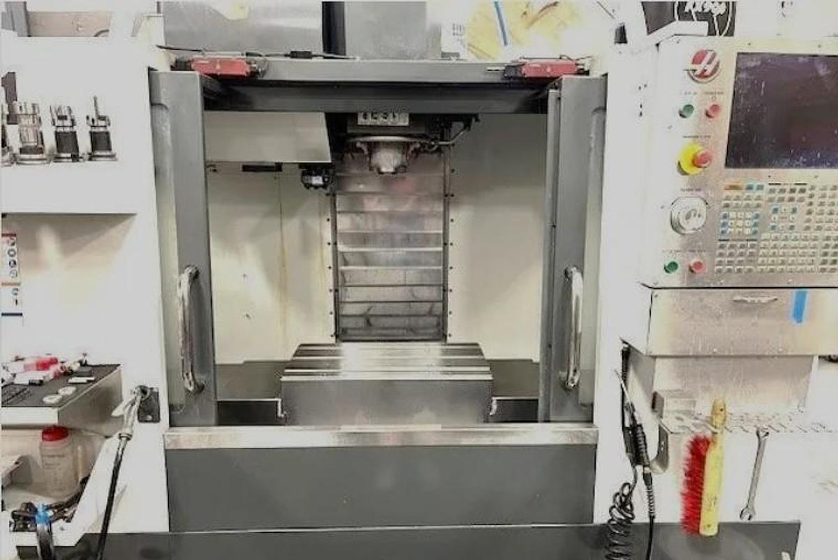 Used 2015 Haas VF1 with 10,000 RPM, 24 Station Side Mounted ATC, Chip Auger, Extended Memory, Remote Jog Handle