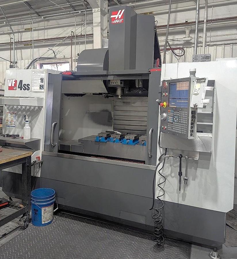 Used 2013 Haas VF-4SS w/ 4th Axis Drive, 24 Station Side Mounted ATC, Programmable Coolant, Multi Auger Conveyor, 12,000 RPM