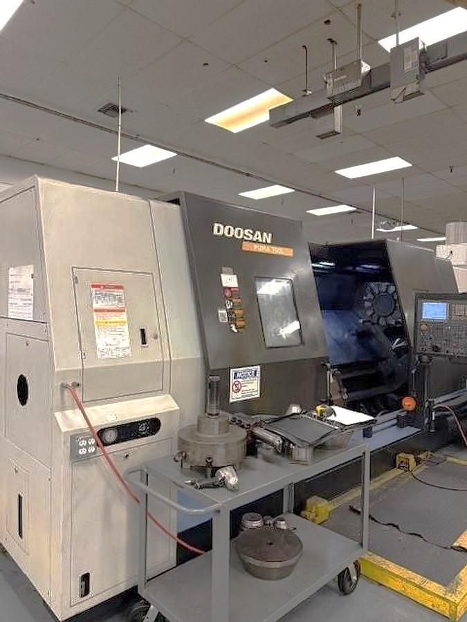 Used 2012 Doosan Puma 700L with 24" Hyd. Chk, 6.5" Bar Cap., 126" Turn Length, SMW Steady Rest, Tailstock, Conveyor, Tool Eye