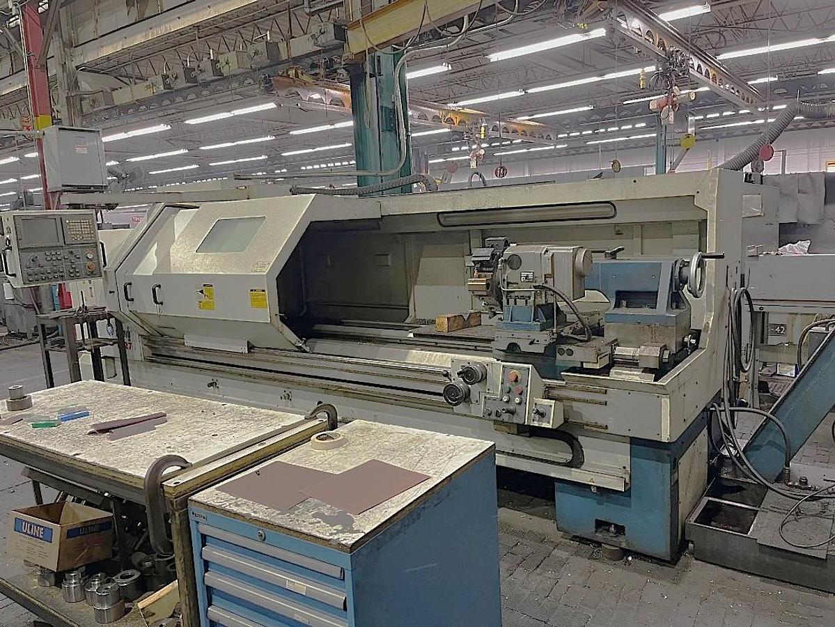 Used 2002 Romi M27 x 120" with 4" Bar Capacity, Tailstock, 15" Chuck, 8 Station Turret, Chip Conveyor