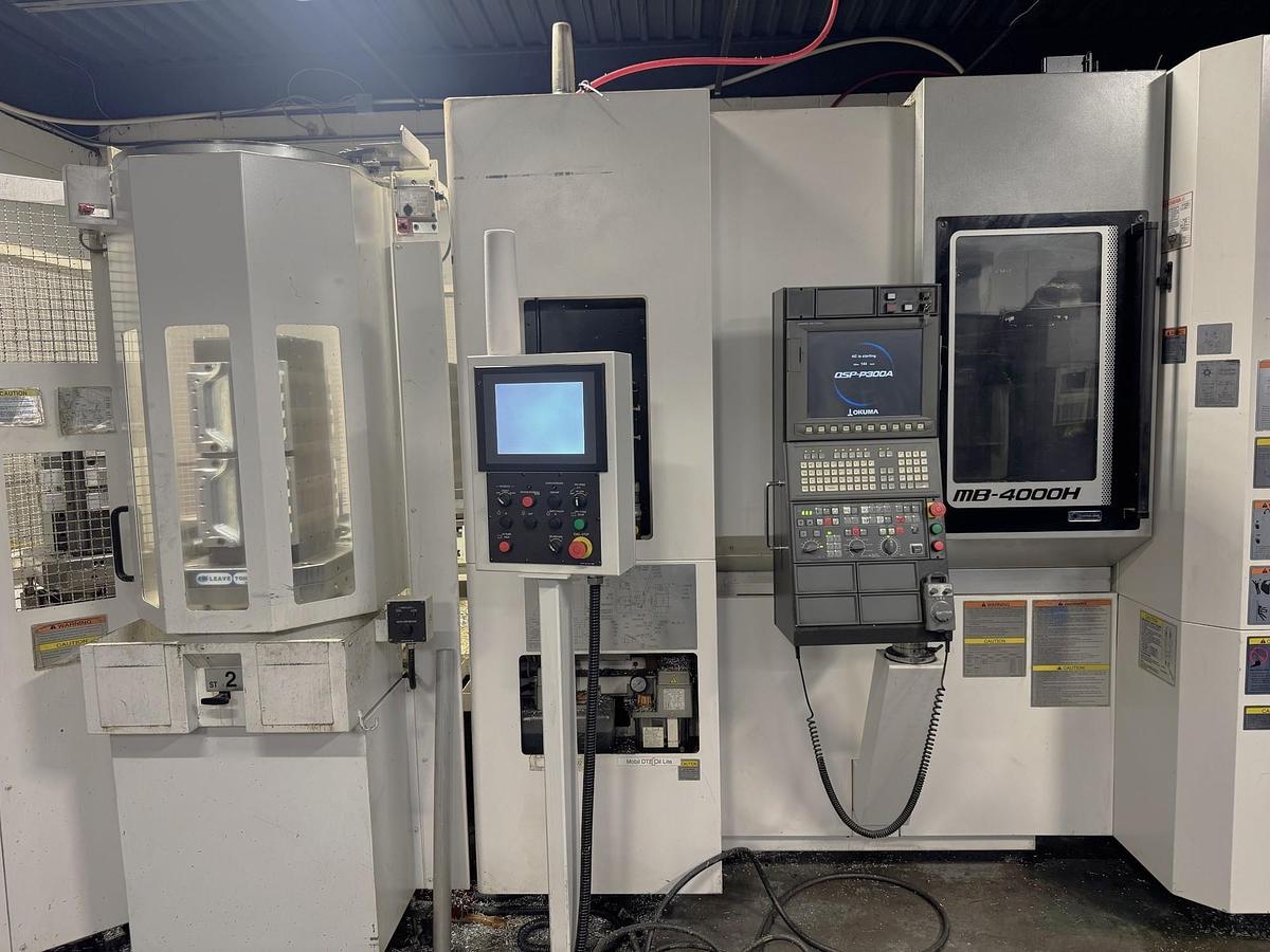 Used 2017 Okuma MB-4000H with 6 Station Rotary Pallet Changer, Full 4th Axis Rotary Tbl, 15k RPM, HSK63 Tpr., HPC, Probing, 64 Pos ATC