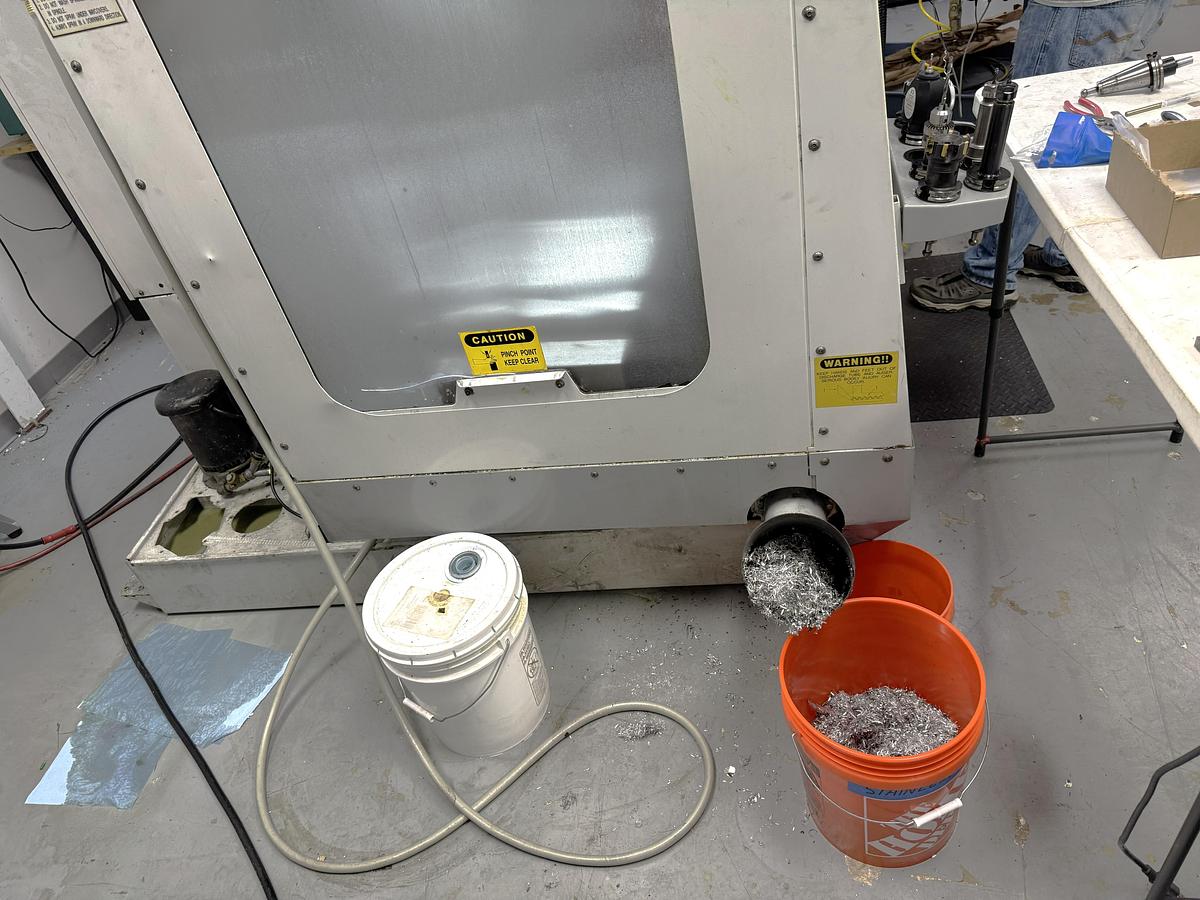 Used 2002 Haas VF2D with Haas Rotary Table, 24 Station Side Mount ATC, Chip Auger, Programmable Coolant