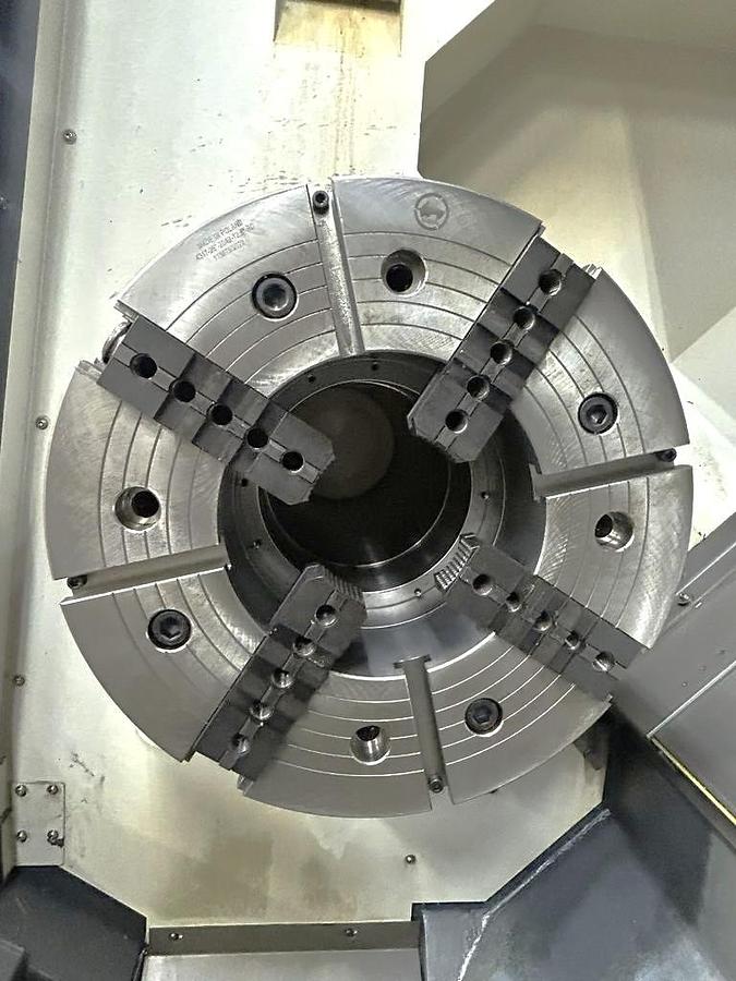 Used 2022 DN Solutions Puma 5100LC with 24.75" 4 Jaw Hyd. Chuck, 10.5" Spindle Bore, 82" Turn Length, Chip Conveyor, Tailstock