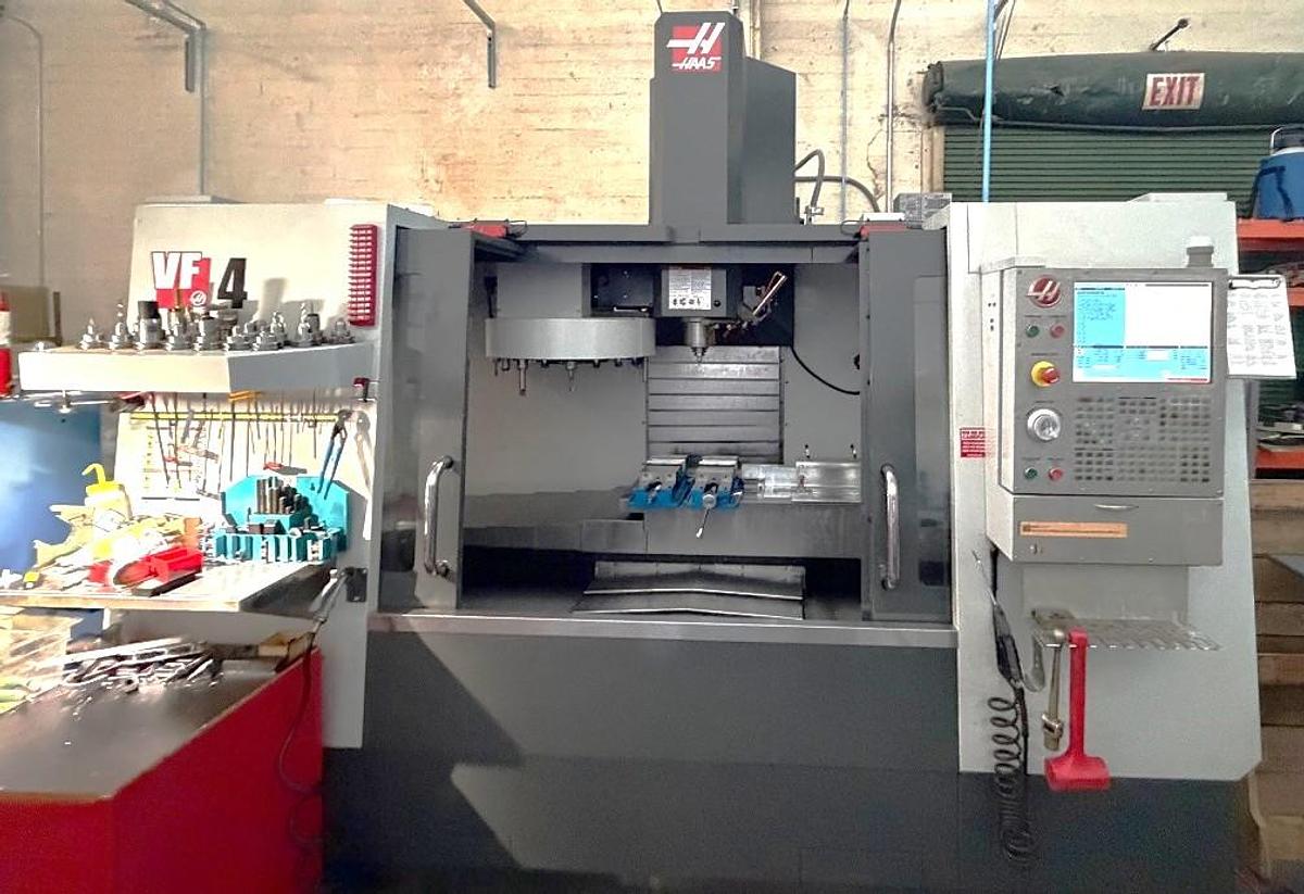 Used 2014 Haas VF-4 , WIPS Renishaw Part & Tool Probe, 4th Axis Drive, Auto Air Gun, Chip Auger, Rigid Tapping