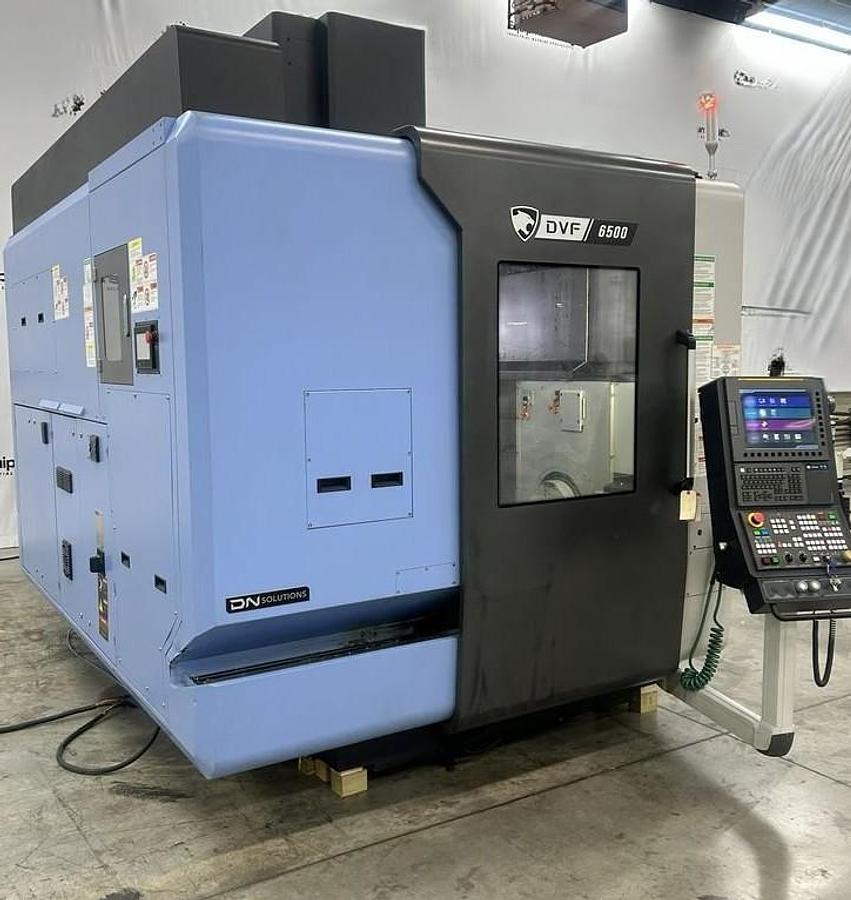 Used 2022 DN Solutions DVF 6500 5 Axis Trunnion VMC with 18,000 RPM, 60 ATC, Coolant Thru Spindle, Probing, Chip Conveyor