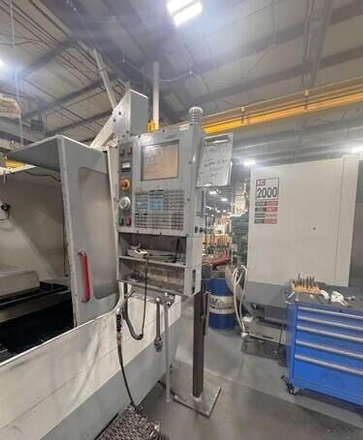 Used 2004 Haas VF8/50 with 50 Taper Spindle, 10,000 RPM Geared Head, Coolant Thru Spindle, Probe Ready, PCool, Auger, Side Mounted ATC