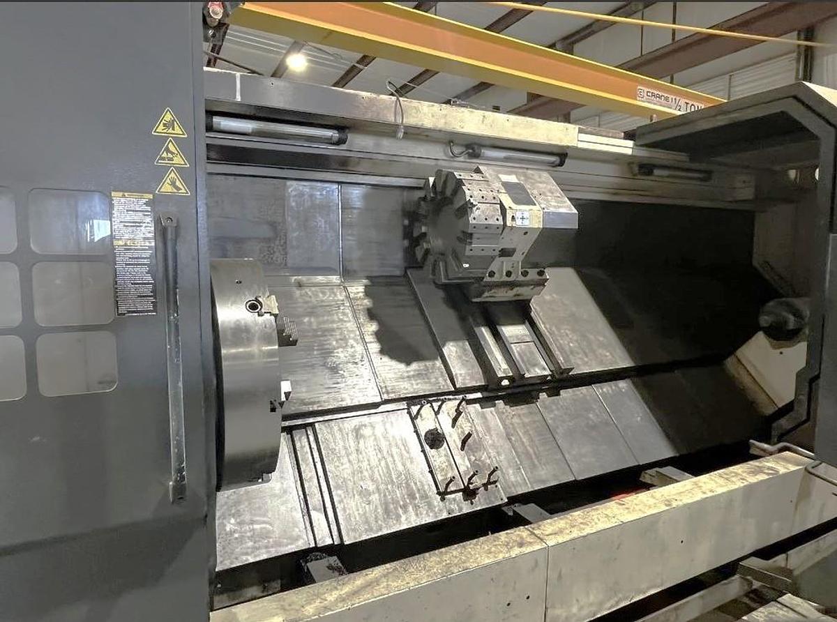 Used 2012 Chevalier FBL-530C with 12.59" Bore, 32" 4 Jaw Manual Front Chk, 28" Rear Air Chk, Tailstock, 118" cc, 500 RPM, Conveyor 