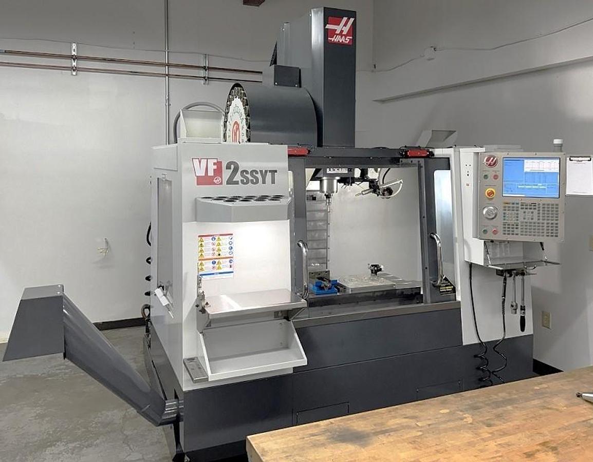 Used 2012 Haas VF-2SSYT with 24 Pos. Side Mount ATC, 12k RPM, Haas Probing, Auger, PCool, Auto Air Gun