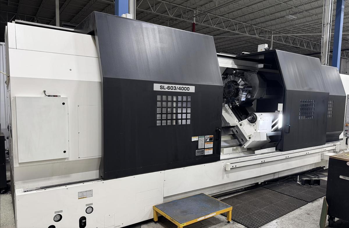 Used 2022 DMG Mori SL603BMC/4000 with C Axis/Live Milling, 28" 3 Jaw Chk, 21" Rear Chk, Steady Rests, 7.3" Bar Cap., Fanuc