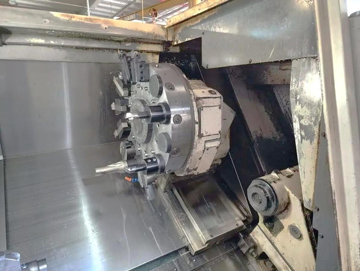 Used 2005 Okuma Captain L470M with C Axis, Milling Capability, 12" Hyd. Chuck, Tailstock, Tool Presetter, Chip Conveyor