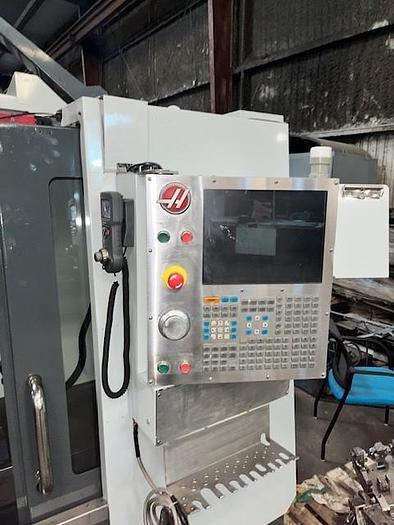Used 2014 Haas VF4 with Haas HRT210 4th Axis Rotary Table, 24 Station SMATC, PCool, Chip Auger