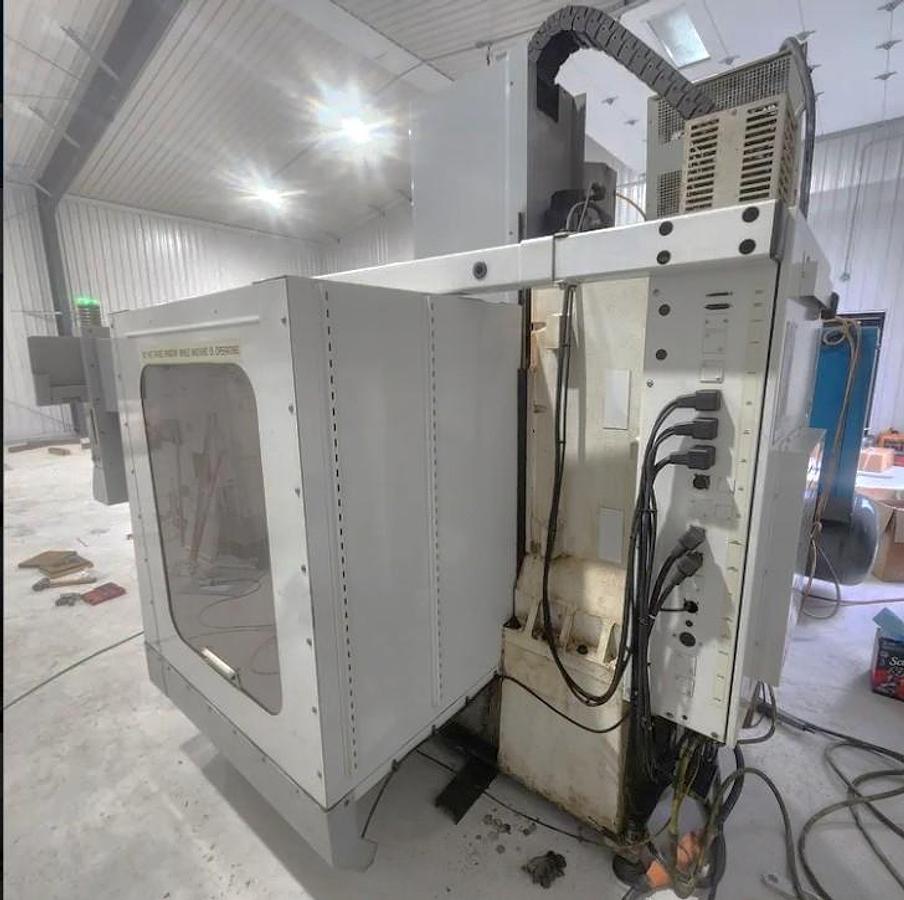Used 2001 Haas VF2 with 4th Axis Drive, Programmable Coolant, Chip Auger, USB Emulator, Rigid Tapping, 24 Station Side Mounted ATC