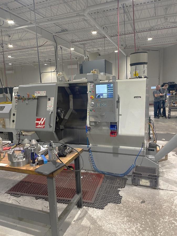 Used 2006 Haas SL-30T with Haas Servo 300 Barfeeder, 3" Bar Capacity, 10" Chuck, Tailstock, Toolsetter, Chip Auger, 12 Pos. Block Turret